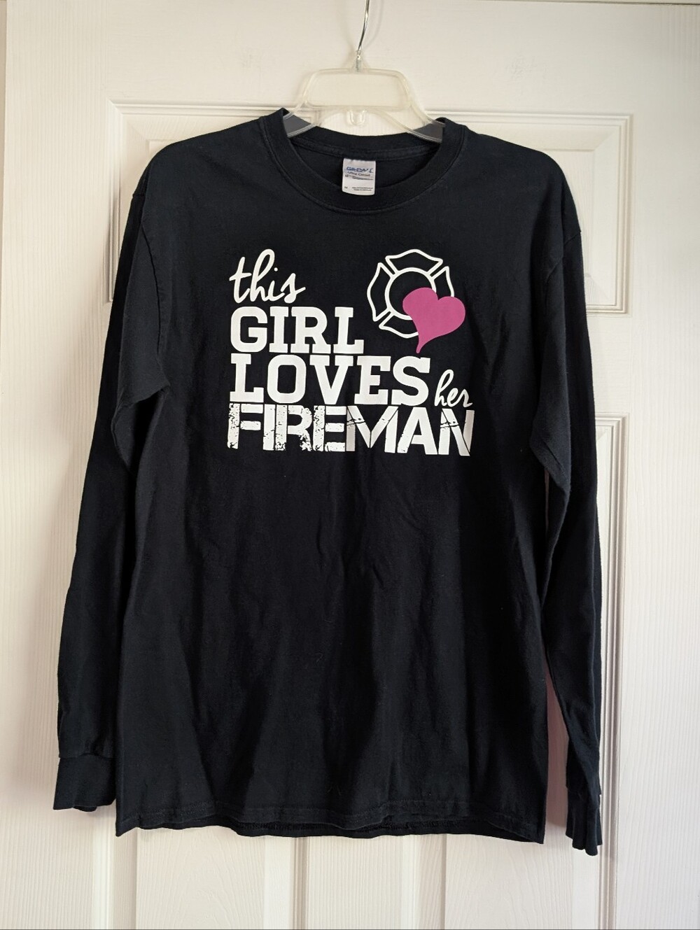 Black Long Sleeve Tee with "This Girl Loves Her Fireman" And A Pink Heart Size M